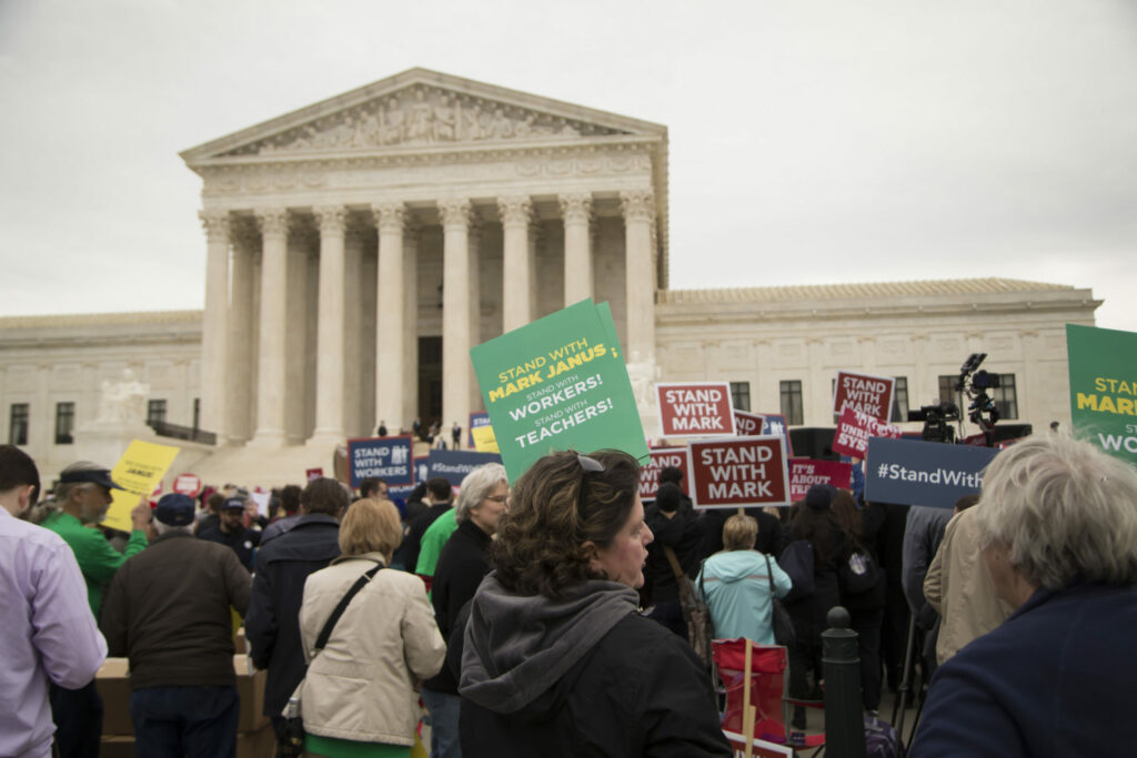 Volunteers gather outside the Supreme Court in support of Mark Janus and Janus v. AFSCME. 