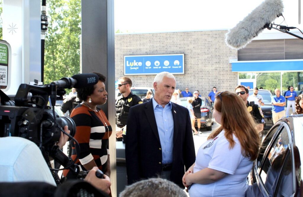 Former Vice President Mike Pence speaks with customers about the high cost of gas at AFP's True Cost of Washington gas rollback event in Hobart, Indiana.
